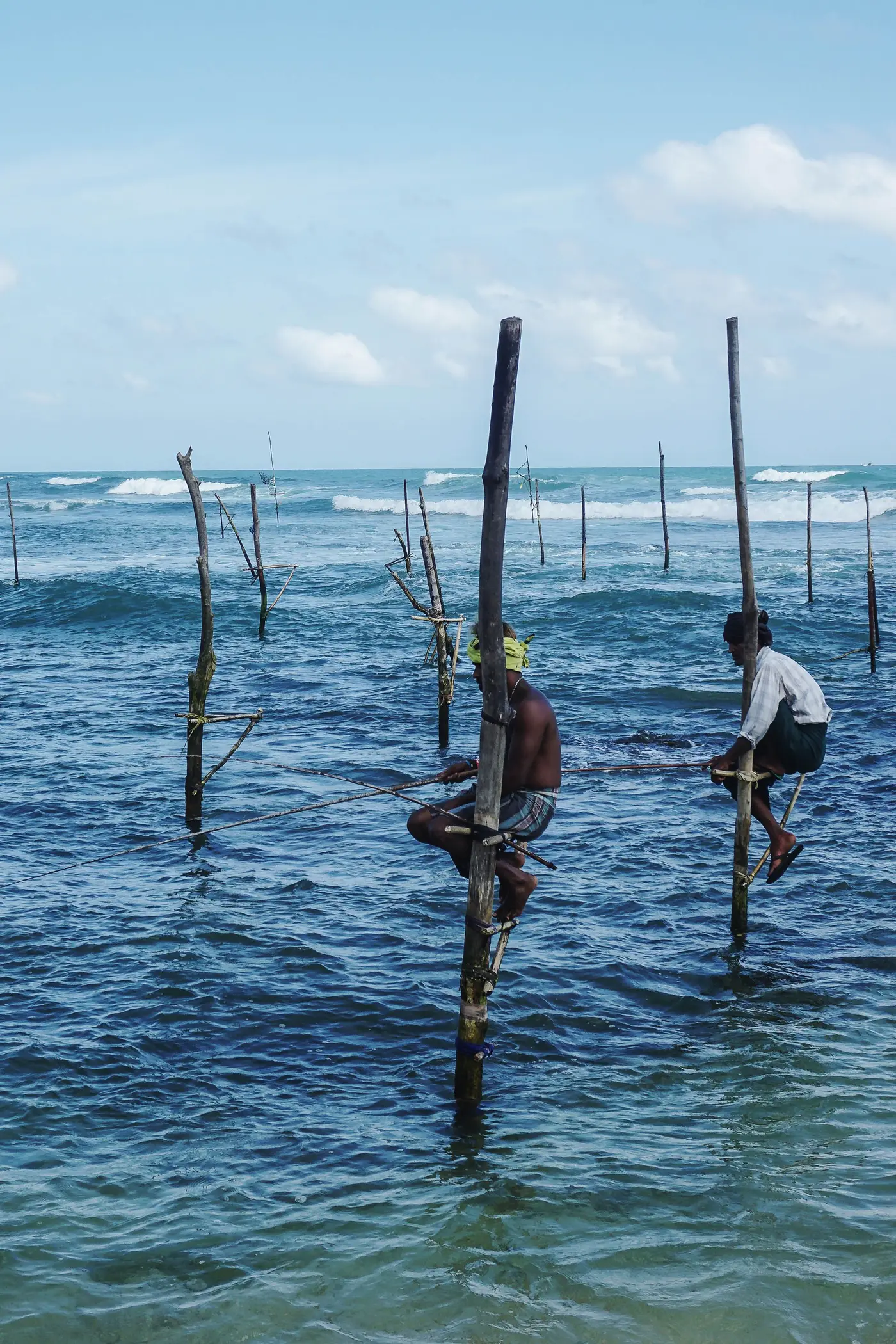 Stilt fishermen perched above the waves along the southern coast